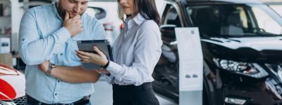 Man choosing a car and talking with salesperson Man choosing a car and talking with salesperson